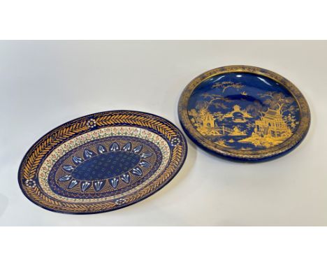 A French Quimper ware decorative slip ware platter (w- 38cm) and a Carlton Ware bowl decorated with a pagoda scene (w-32cm). 