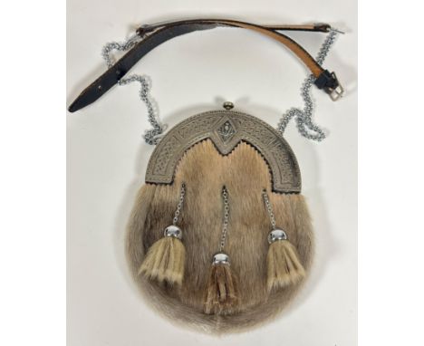 An Epns sealskin sporran with Celtic knop and thistle mounted top, fitted three plated tassels, complete with chain and leath