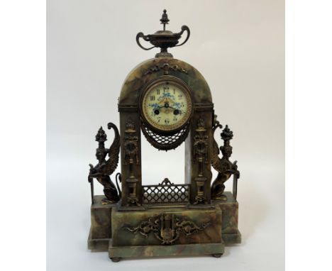 An Egyptian revival onyx mantel clock, late 19th century, the case with urn final over swag, harebell and torch gilt metal mo