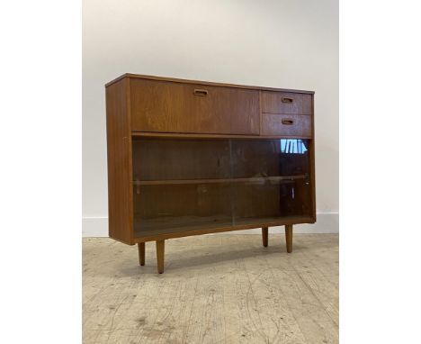 A mid century teal bookcase, fitted with a fall front writing compartment fitted with correspondence shelves, flanked by two 