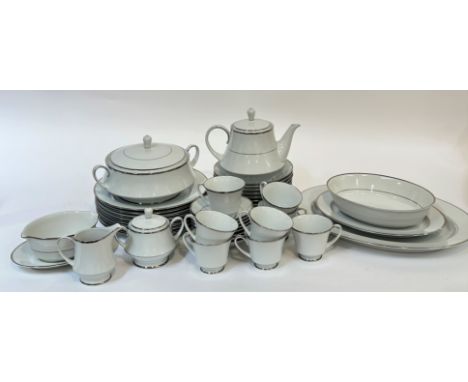 A Noritake Spectrum part dinner service with silver rims comprising two platters, a serving bowl, a sauce boat and flat, eigh