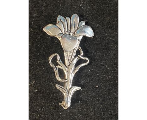 A vintage MASJ pewter and silver plated brooch 