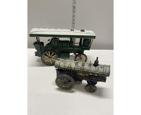One tin plate steam engine model and one smaller cast iron tin plate model 