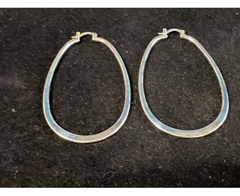 A pair of stamped 925 large silver hoop earrings. 7.5cm tall 