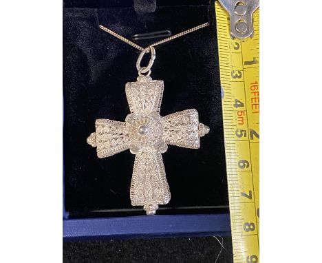 A white metal pendant on a 925 silver chain 