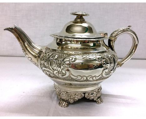 C19th Victorian Silver Bachelor Teapot with circular body, band of embossed c-scroll & flowers, cartouche with crest, spout w