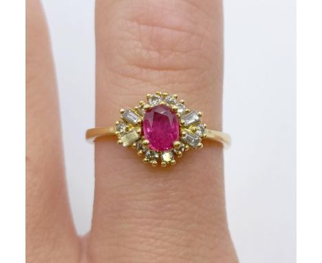 An 18ct gold, diamond and ruby ring, ring size N 
