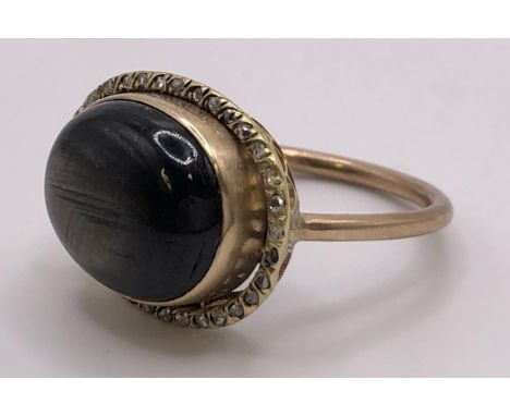 A cabochon cut gem set ring, ring size K 