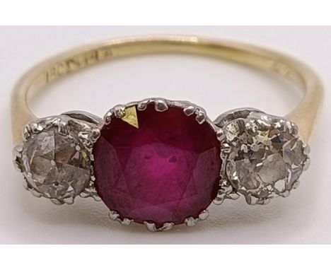 An 18ct gold, ruby and diamond ring, ring size Pmaarket fresh and dirtyall stones older cutcentral stone approx 8 mm diam, fl