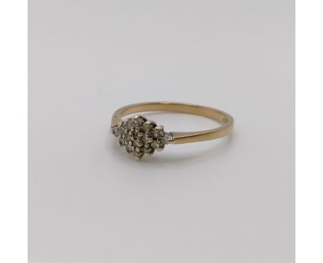 An 18ct gold and diamond cluster ring, ring size N 