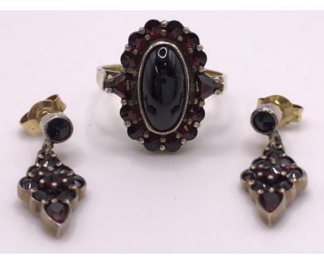 A 9ct gold and cabochon garnet cluster ring, ring size L, and a similar pair of earrings (3) 