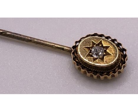 An early 20th century 15ct gold and diamond stick pin, casedBox is in poor order 