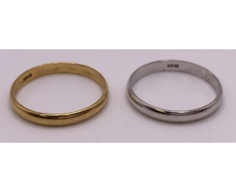A 9ct gold wedding band, ring size S, and 9ct white gold wedding band, ring size S, 3.8 g (2) 