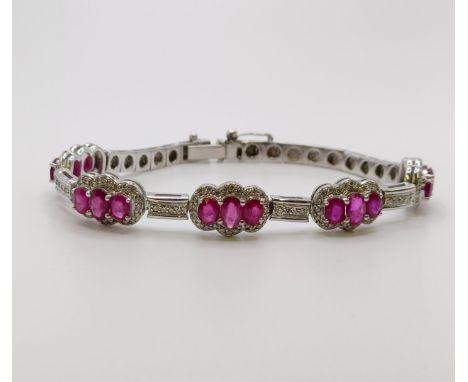 An 18ct white gold, diamond and ruby bracelet 
