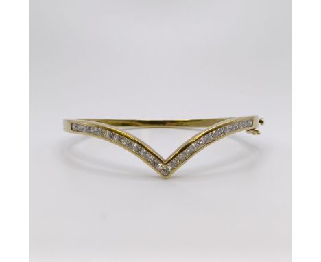 A yellow metal and diamond bangle, diamond weight approx. 3ctAll in 17.8 g 