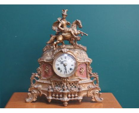 GILT METAL VICTORIAN STYLE MANTEL CLOCK WITH PIERCEWORK DECORATION APPROXIMATELY 42cm HIGH 