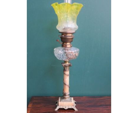 STELLAFORM CARBON OIL LAMP WITH CLEAR GLASS RESERVOIR AND YELLOW ACID ETCHED TULIP GLASS SHADE, ON MARBLE EFFECT AND ORMOLU M