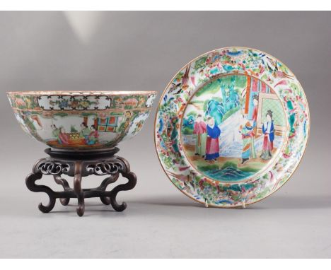 A Canton famille verte enamel bowl with figure decorated panels, 9" dia, on carved hardwood stand, and a similar plate with f