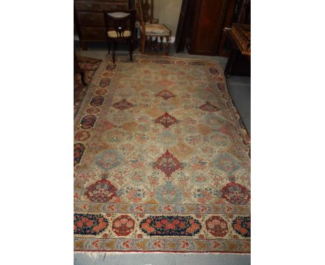 A Persian city rug with all-over floral design on a light blue ground, 122" x 87" approx (worn) 