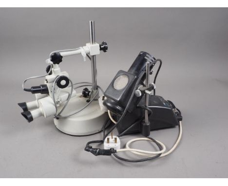 A "Prior" binocular microscope and spot light 
