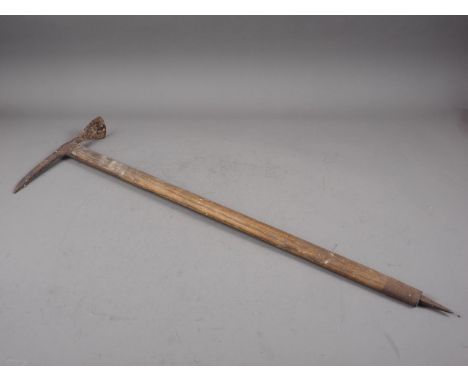 An early 20th century ice axe, 33 3/4" high 
