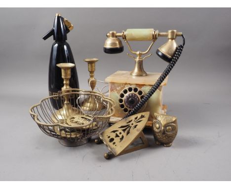 An onyx and brass mounted rotary telephone, a pair of brass candlesticks, a soda siphon, horse brasses, a pair of Egyptian wa