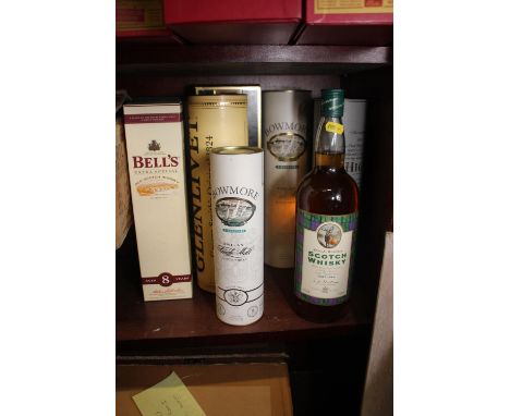 A bottle of Waitrose 12-year old Highland single malt whisky, a bottle of Bells Extra Special Scotch Whisky, a bottle of The 