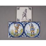 Two Dutch polychrome soldier decorated Delft tiles, 5" square, and one other similar