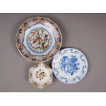 A Makkum Delft polychrome shallow dish with exotic bird decoration, 9 1/2" dia, a smaller similar