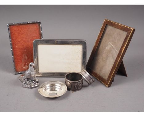 A silver model of a pheasant, a silver napkin ring, a silver miniature armada dish, a Chinese napkin ring and two white metal