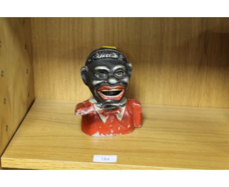 A CAST VINTAGE MECHANICAL MONEY BOX 
