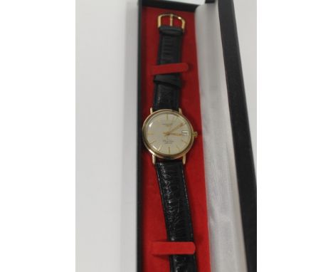A VINTAGE LONGINES 9CT GOLD FLAGSHIP AUTOMATIC WRISTWATCH WITH DATE APERTURE 