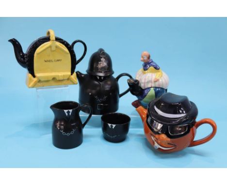 A Carlton Ware 'Wheel Clamp' teapot, Clown teapot and a Policeman with sugar and cream jug