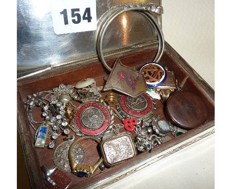 Plated casket containing assorted jewellery, enamel badges etc., some silver