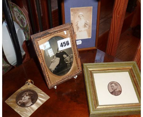 Victorian tin type photograph of a mother and children, a 1920s photo portrait of a flapper in a faux silk plastic frame and 