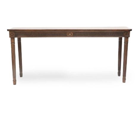 An Adam Period Mahogany Serving Table, late 18th century, the nulled frieze on ring turned and fluted tapering legs195.5cm by