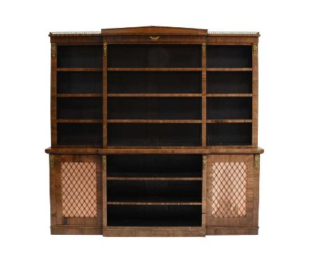 A Regency Rosewoood and GIlt Metal Mounted Library Bookcase, early 19th century, of breakfront form with architectural pedime