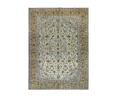 Kashan Carpet Central Iran, Circa 1970 The ice blue field of scrolling vines and palmettes centred by a discrete small flower