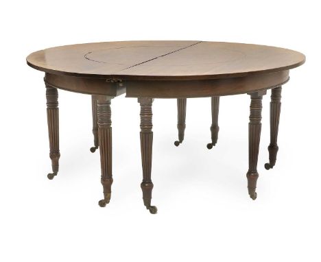 A Mahogany Hunt Table, in the manner of Gillows, early 19th century, of D shaped form, the moulded frieze on eight ring turne