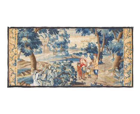 Flemish Verdure Tapestry, Circa 17th Century Woven in wool and silk, depicting an itinerant salesman offering his wares to a 