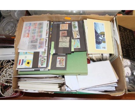 A collection of postcards, stamps and first day covers to include Stanley Gibbons Swiftsure stamp album, containing various w