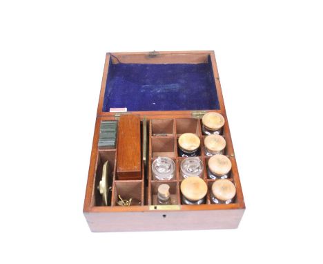 A 19th century set of slide preparing equipment, housed in a fitted mahogany case containing tools, slides, and chemicals