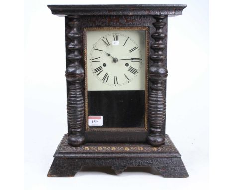 A mid 19th century Black Forest mantel clock with black lacquered case with square white enamel Roman dial, the two train spr