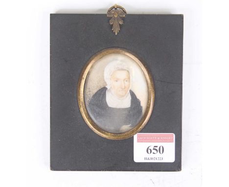 English School, 19th century, portrait minature half length study of an elderly lady, watercolour on ivory, oval 6x5cm, in fu