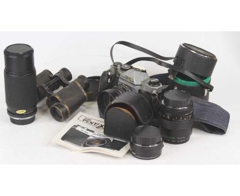 A Pentax K1000 film camera; together with various lenses and accessories to include a Makinon lens