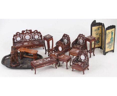 A collection of Chinese dolls house furniture to include carved hardwood mother of pearl inlaid three seater sofa and three m