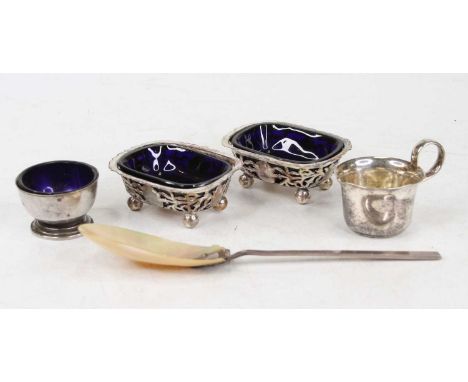 A pair of silver table salts, each of pierced oval form with blue glass liners; one other silver footed table salt; plated mi