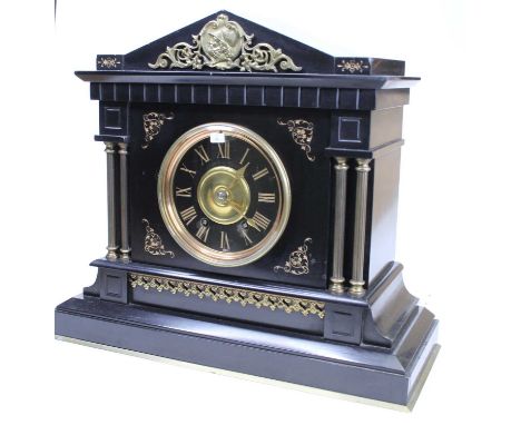 A late Victorian slate mantel clock, case of architectural outline, with brass mounts and by Henderson &amp; Co. (1875-81) an
