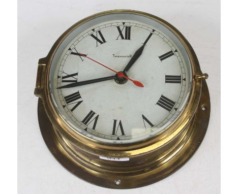 A 20th century brass cased ship's style bulkhead clock, the dial showing Roman numerals, dia. 20cm