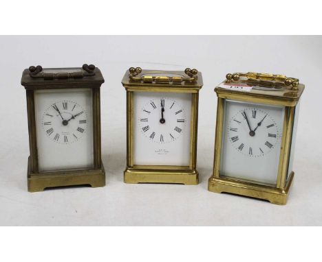 An early 20th century French lacquered brass carriage clock, having single barrel going eight-day movement, h.11cm; together 